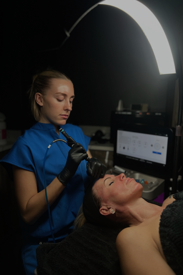 Professional HydraFacial treatment performed on a woman’s face in a spa