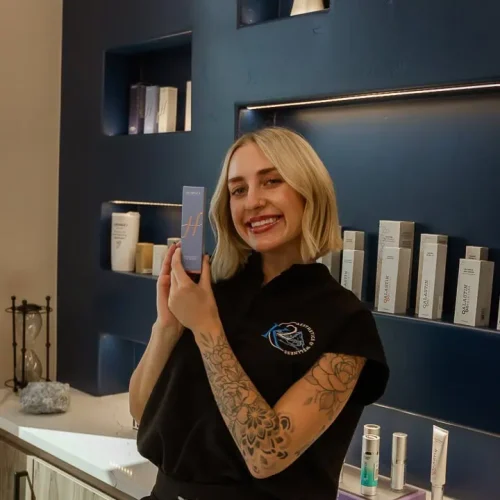A professional presenting medical grade skin care solution
